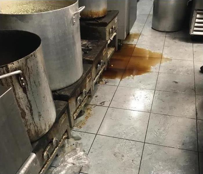 a picture of a restaurant kitchen after a fire and water damage